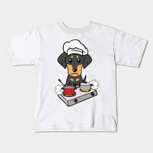 Funny dachshund is cooking Kids T-Shirt